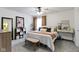 Spacious primary bedroom with ceiling fan, a large window, and ample natural light at 12612 Clearview Ln, Indianapolis, IN 46236
