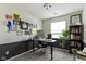 Office with two-toned walls and a large window at 12612 Clearview Ln, Indianapolis, IN 46236