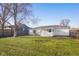 A full view of the backyard and back exterior elevation at 1319 Brookside Dr, Columbus, IN 47201