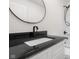 Bright bathroom with granite counters, modern fixtures and bath-shower combination at 1319 Brookside Dr, Columbus, IN 47201