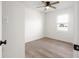 Bright bedroom with stylish flooring, modern ceiling fan and a window at 1319 Brookside Dr, Columbus, IN 47201