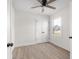 Comfortable bedroom featuring wood-look flooring, a modern ceiling fan and a window at 1319 Brookside Dr, Columbus, IN 47201