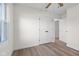 Well-lit bedroom includes updated flooring and spacious double door closet at 1319 Brookside Dr, Columbus, IN 47201