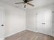 Cozy bedroom with wood-look flooring, a stylish ceiling fan and bright natural light at 1319 Brookside Dr, Columbus, IN 47201