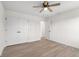 Bright bedroom featuring neutral walls, modern ceiling fan, and light wood-look flooring at 1319 Brookside Dr, Columbus, IN 47201