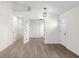 Spacious living room featuring wood-look flooring, white walls and open doorway design at 1319 Brookside Dr, Columbus, IN 47201