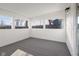 The sunroom features neutral paint, carpet, and a door leading to the backyard at 1319 Brookside Dr, Columbus, IN 47201