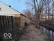 Property with a fenced boundary bordering a stream, offering both privacy and a natural setting at 133 Tripps Ave, Lebanon, IN 46052