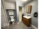 Small bathroom features essential amenities including a toilet, shower, vanity, and storage at 133 Tripps Ave, Lebanon, IN 46052