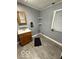 Simple bathroom with neutral gray walls, providing basic fixtures and a clean appearance at 133 Tripps Ave, Lebanon, IN 46052