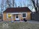 Modest single-story home with a brick facade, front porch and small well-manicured front yard at 133 Tripps Ave, Lebanon, IN 46052