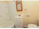 Modest bathroom featuring a shower-tub combo and a white vanity, offering essential functionality at 1937 N Lasalle St, Indianapolis, IN 46218