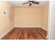 Bright empty bedroom with wood floors and a ceiling fan at 1937 N Lasalle St, Indianapolis, IN 46218