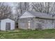 View of detached block garage and shed in backyard of property at 1937 N Lasalle St, Indianapolis, IN 46218