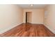 View of an empty living room with hardwood floors and natural light at 1937 N Lasalle St, Indianapolis, IN 46218