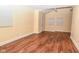 View of an empty living room with hardwood floors and a sloped ceiling at 1937 N Lasalle St, Indianapolis, IN 46218