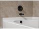 This bathroom features bronze fixtures near the soaking tub at 2016 Woodland Parks Dr, Columbus, IN 47201