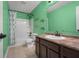 Vibrant bathroom with a shower-tub combo and owl decorations, perfect for  at 2016 Woodland Parks Dr, Columbus, IN 47201