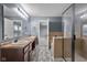 Bright bathroom featuring double sinks, a glass shower, and an inviting atmosphere at 2016 Woodland Parks Dr, Columbus, IN 47201