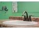 Close up of bathroom sink featuring modern faucet and countertop, creating a clean look at 2016 Woodland Parks Dr, Columbus, IN 47201