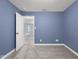 Inviting bedroom with a neutral carpet and doorway, perfect for peaceful relaxation at 2016 Woodland Parks Dr, Columbus, IN 47201