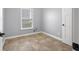 Cozy bedroom featuring tile floors, a bright window, and neutral walls at 2016 Woodland Parks Dr, Columbus, IN 47201
