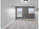 This bedroom features neutral carpet, gray walls, and two windows that let in plenty of natural light at 2016 Woodland Parks Dr, Columbus, IN 47201