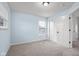 Inviting bedroom with soft carpet, bright windows, and a convenient closet at 2016 Woodland Parks Dr, Columbus, IN 47201