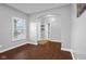 Inviting room with hardwood floors, arched entry, and a view of the front door at 2016 Woodland Parks Dr, Columbus, IN 47201