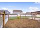 Backyard garden area fully enclosed with chicken wire fence and wooden posts offering privacy for outdoor gardening at 2016 Woodland Parks Dr, Columbus, IN 47201