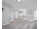 Upstairs hallway with carpeted floor, multiple doors, and overhead lighting at 2016 Woodland Parks Dr, Columbus, IN 47201