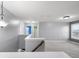 Bright upstairs hallway with carpet and white trim throughout the house at 2016 Woodland Parks Dr, Columbus, IN 47201