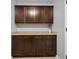 Laundry room area with plenty of storage space in the wood cabinets at 2016 Woodland Parks Dr, Columbus, IN 47201