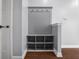Mudroom with coat rack, shelving, and dark hardwood flooring at 2016 Woodland Parks Dr, Columbus, IN 47201
