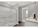 This bathroom features a double vanity and tiled shower with glass doors at 2171 Mildred Rd, Westfield, IN 46074