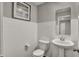 Classic powder room featuring white subway tiles, pedestal sink, and stylish fixtures at 2171 Mildred Rd, Westfield, IN 46074