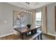 Contemporary dining room featuring a wooden table with bench, accent lighting, and stylish decor at 2171 Mildred Rd, Westfield, IN 46074