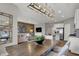 Open-concept dining area showcasing a modern table, leading to the living room and kitchen at 2171 Mildred Rd, Westfield, IN 46074