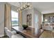 A modern dining room featuring a wood table, chairs and view to the living room at 2171 Mildred Rd, Westfield, IN 46074