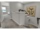 Upstairs hallway features neutral carpeting, art and a view into a bedroom at 2171 Mildred Rd, Westfield, IN 46074
