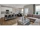 Open-concept living space with a modern kitchen island and breakfast bar seating at 2171 Mildred Rd, Westfield, IN 46074