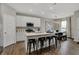 Bright kitchen featuring an island with barstool seating, stainless steel appliances, and pendant lighting at 2171 Mildred Rd, Westfield, IN 46074