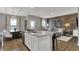 Open kitchen and living area featuring a center island and hardwood flooring at 2171 Mildred Rd, Westfield, IN 46074