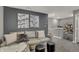 Modern living room with stylish sofa, ottoman, and accent wall decor at 2171 Mildred Rd, Westfield, IN 46074