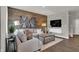 Comfortable living room featuring a wood-look accent wall, neutral furniture, and stylish decor at 2171 Mildred Rd, Westfield, IN 46074