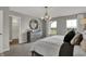 This main bedroom features a decorative mirror, dresser, and light fixture at 2171 Mildred Rd, Westfield, IN 46074