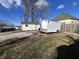 Backyard view of the home with a garage and trailer at 218 S 5Th Ave, Beech Grove, IN 46107