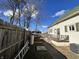 View of the house with a fenced yard, back porch and air conditioning unit at 218 S 5Th Ave, Beech Grove, IN 46107