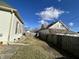 Residential backyard with a wooden fence, lawn, and view of the neighboring house at 218 S 5Th Ave, Beech Grove, IN 46107