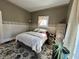 Bedroom with patterned walls, a window with curtains, and decorative rug at 218 S 5Th Ave, Beech Grove, IN 46107